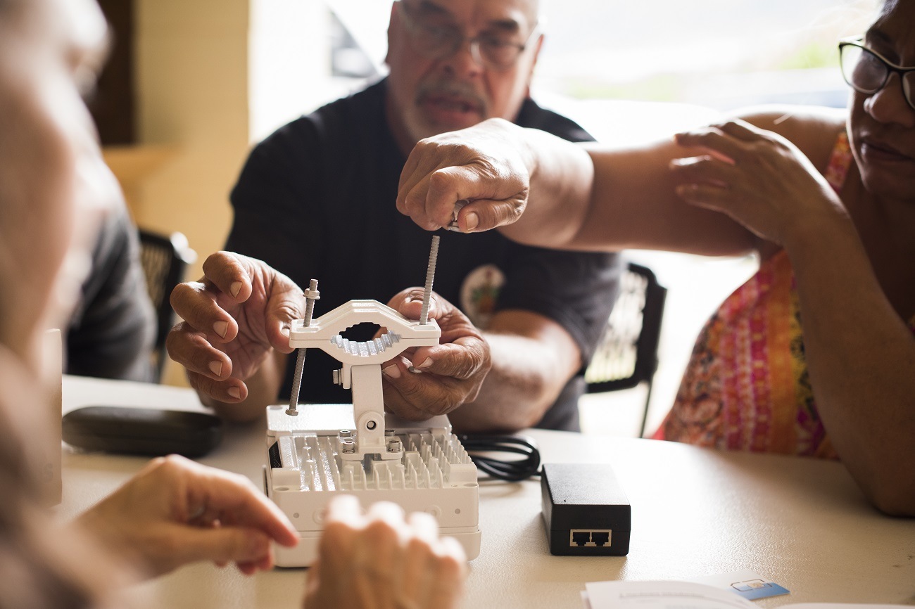 group on people building something at a table