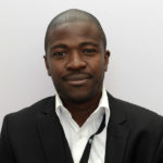 a man in a suit posing