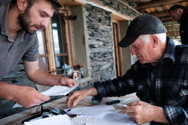 Two men examining papers in Georgia