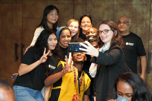 a group of people taking selfie