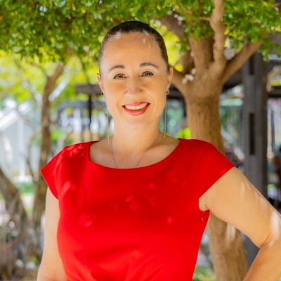 a woman in a red shirt posing for a photo